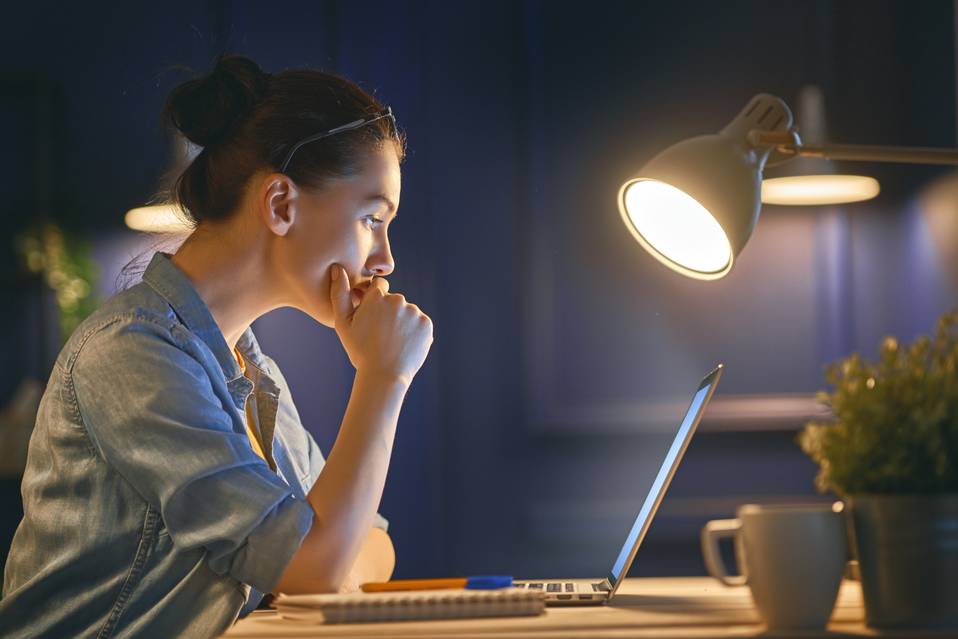 Woman working late (Photo by Konstantin Yuganovhong on stock.adobe.com)
