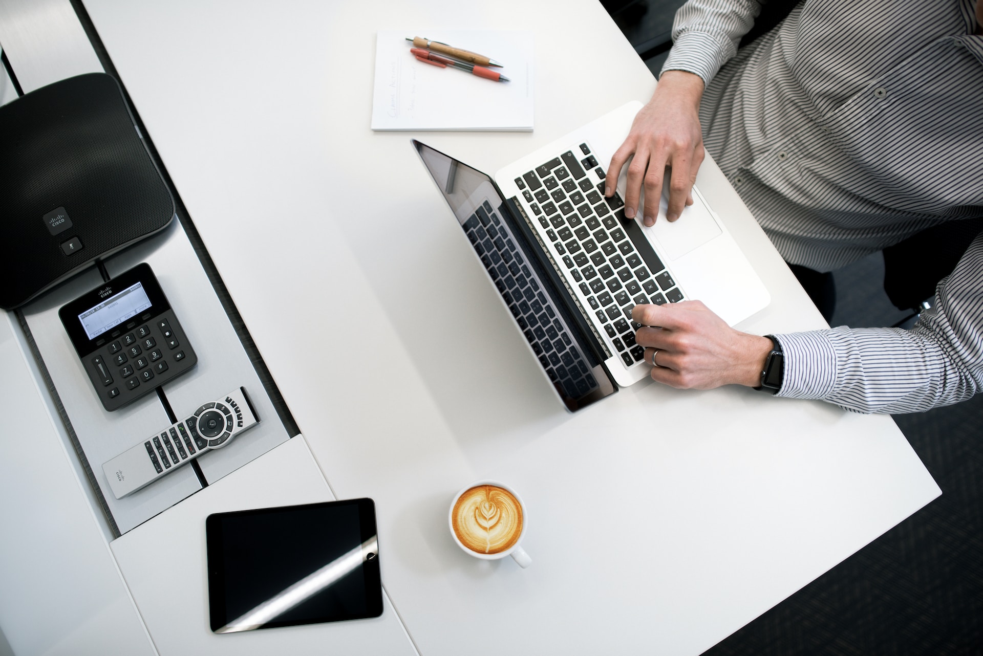 Man sitting at laptop calculating business costs