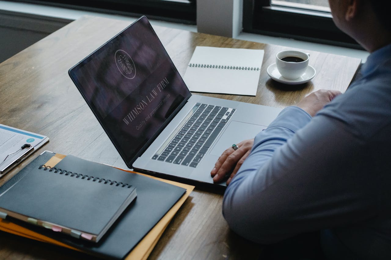 Male law expert using laptop